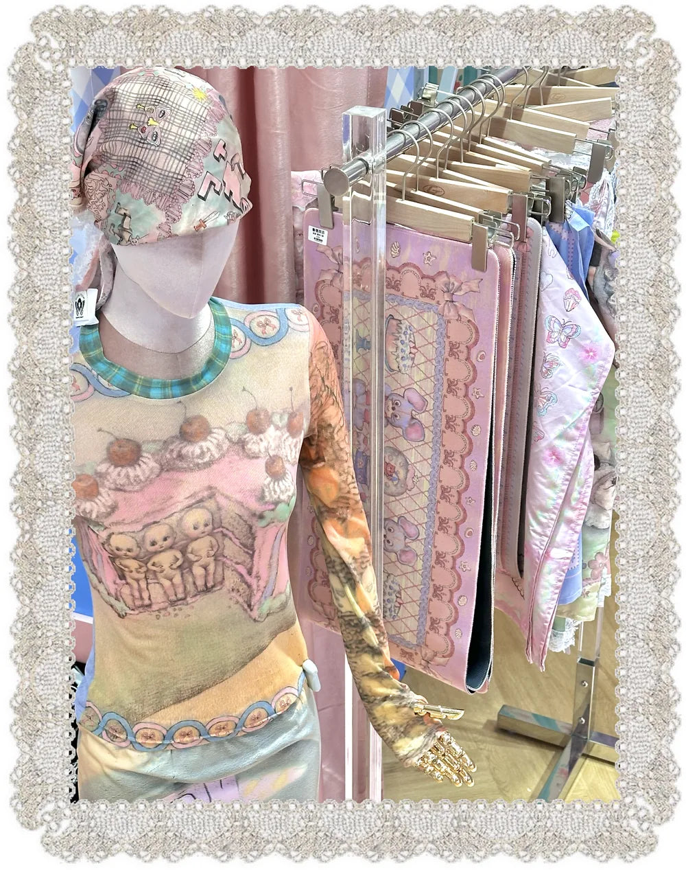 Mannequin in a RudeFish printed top beside a rack of printed bags